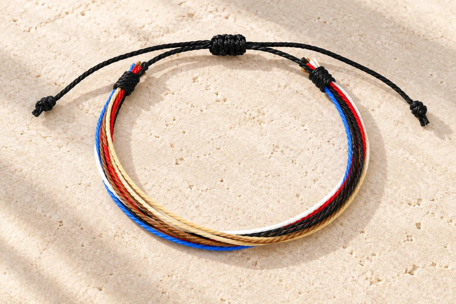 Editorial visualization of the Pangea bracelet on pale stone.